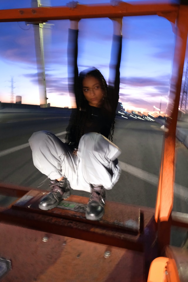 Picture of a girl posing with dark hair and doc martin shoes