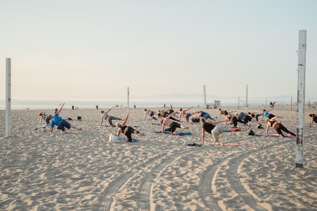 an image of yoga in beach