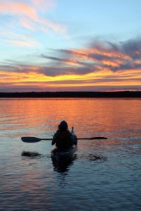 Kayak on the lake with sunset