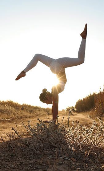 A woman doing yoga in the wilderness