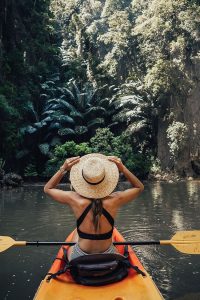 back view of woman on kayak
